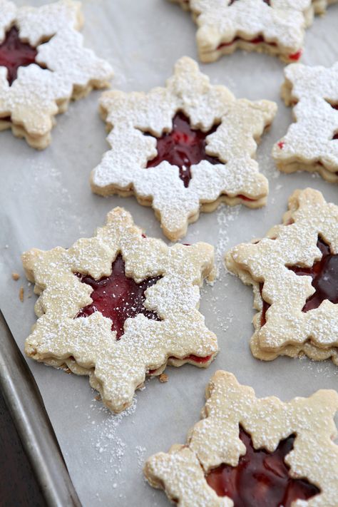 We're kicking Christmas Cookie Week off with some classic holiday cookies: Raspberry Linzer Snowflake Cookies. They're delightful and oh-so-delicious! Snowflake Cookies Recipe, Raspberry Linzer Cookies, Linzer Cookies, Snowflake Cookies, Raspberry Filling, Entertaining Recipes, Tea Cakes, Sweet Desserts, Holiday Cookies