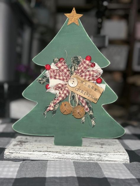 CCC (Crafty Creators Community) | Made this cute Christmas Tree from a dollar treee wood cut out Wood Christmas Tree Cutout, Christmas Tree Cut Out, Tree Cut Out, Christmas Tree Wreath, Cute Christmas Tree, Wood Christmas Tree, Dollar Tree Christmas, Christmas Tree Crafts, Wooden Christmas Trees