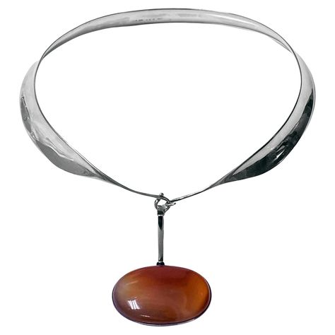 Vivianna Torun Bulow Hube for George Jensen, a rare Sterling Silver Necklace with reddish brown banded agate detachable pendant on collar, Denmark, C. 1975, stamped Georg Jensen in a dotted oval, Denmark, Torun, 133 pendant and 160 collar and 925S. Will fit up to 16 inch neck, pendant drop approximately 2.75 inches, width of agate 2 inches. Item Weight: 123 grams. Ref: The Jewellery Box Jens Ingvordsen P.275. Vivianna Torun Bülow-Hube know as Torun, was born 1927 in Malmo, Sweden. Torun was the Red Agate Necklace, George Jensen, Neck Pendant, Detachable Pendant, Dope Jewelry Accessories, Dope Jewelry, Banded Agate, Georg Jensen, Red Agate