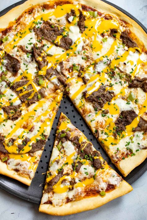 Cheesesteak Pizza is a mash-up recipe you don’t want to miss! Peppers, onions, three layers of cheese, and shaved Sirloin Steak all baked together on a crispy pizza crust! Guaranteed winner! #beefitswhatsfordinner #ad Roast Beef Pizza Recipes, Steak And Cheese Pizza, Steak And Blue Cheese Pizza, Philly Pizza Cheesesteak, Dominos Philly Cheese Steak Pizza, Steak Alfredo, High Fiber Low Carb, Crispy Pizza Crust, Steak Pizza