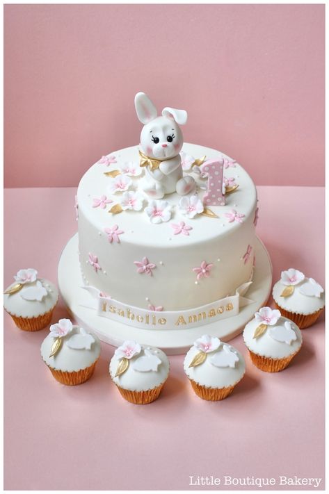 Bunny Blossom Birthday Cake, cute bunny first birthday cake, cute bunny cake topper, baby bunny cake with sugar blossom flowers, matching bunny blossom cupcakes | www.littleboutiquebakery.co.uk Blossom Cupcakes, Bunny First Birthday, Bunny Cake Topper, Blossom Cake, Cake Cute, Iced Biscuits, Bunny Cake, First Birthday Cake, Baby Bunny