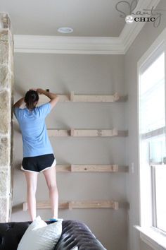 floating shelves......ashley-installing-shelves... Start with 2 by 4 constructed capital E frames attached on the starts... Build up hardwood plywood and one by six for the top and sides of each shelf... Put into place and secure perhaps with pegs or screws... used hardwood plywood to close out the bottom, screw those into place... stain everything before mounting and then touch up in place Shelves On Side Of Fireplace, Floating Shelves By Fireplace, Floating Shelves Around Tv, Shelves Around Fireplace, Side Of Fireplace, Diy Built In Shelves, Shelves Around Tv, Building Shelves, Floating Shelves Living Room