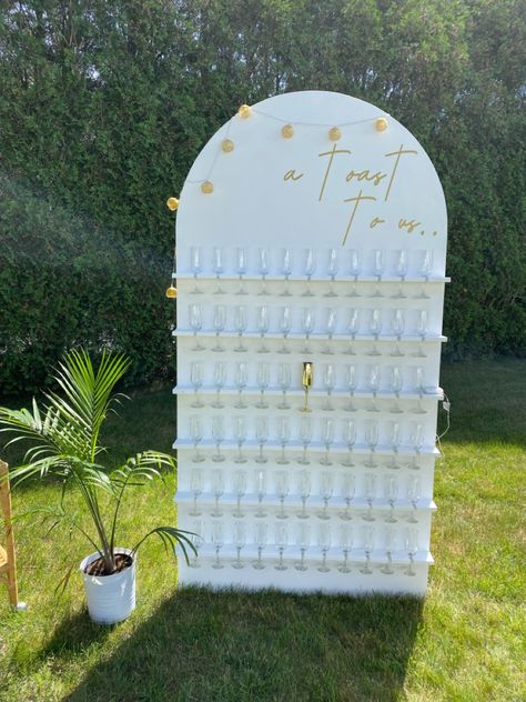 Bridal Shower Ideas Champagne Wall, Build A Champagne Wall, Champagne Wall Engagement Party, Boho Champagne Wall, Bridal Shower Champagne Wall, White Champagne Wall, Champagne Wall Diy, Champagne Wall Seating Chart, Diy Champagne Wall