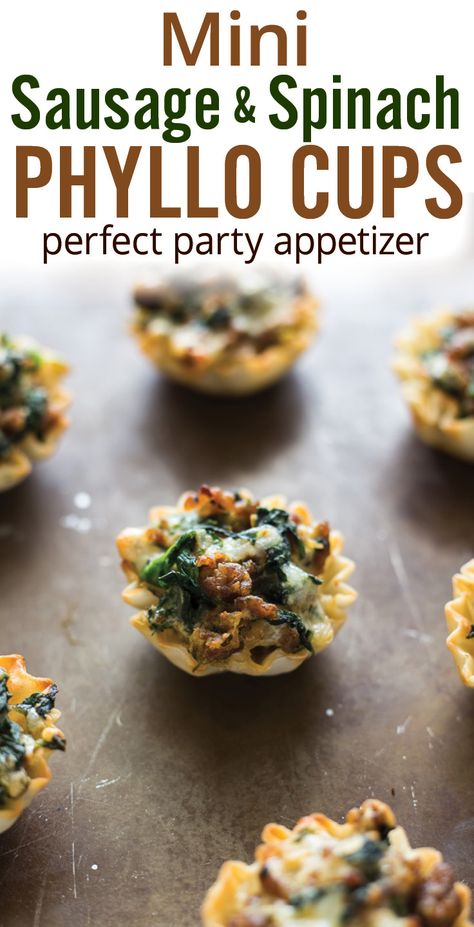 Mini Sausage and Spinach Phyllo Cups. Easy party appetizer recipe by Plating Pixels. @jvillesausage Italian sausage, mushroom, spinach, onion, ricotta, mozzarella and Parmesan cheese in crispy bite size party snacks. [ad] #SausageBowl - www.platingpixels.com Appetizers For Party Bite Size, Friendsgiving Recipes Appetizers, Pilsbury Recipes, Party Food Easy Appetizers, Sausage Mushroom, Sausage And Spinach, Mushroom Spinach, Phyllo Cups, Pastas Recipes