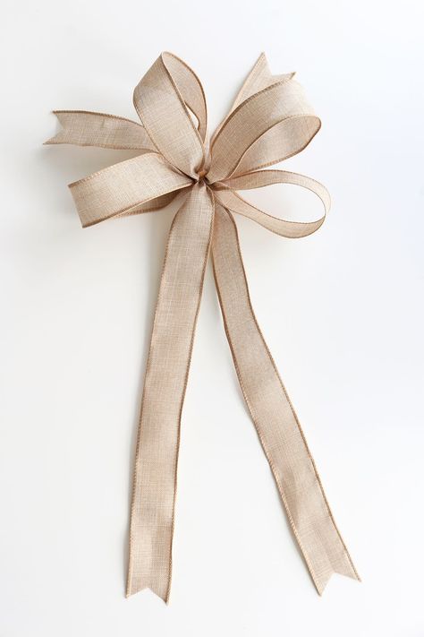 Learn how to make a bow with ribbon! These 12 tutorials are easy to follow and teach you new bow making skills. Use them for gift wrapping, wreaths, tree toppers, and more. Christmas Ribbon Topper Diy, Loopy Bows Diy How To Make, How To Tie A Decorative Bow, How To Make A Bow With Ribbon For Tree, Wire Edge Ribbon Bow Tutorial, Tying A Ribbon Bow, Bow Toppers For Christmas Trees, Diy Bows For Christmas Tree, Tying Bows With Ribbon