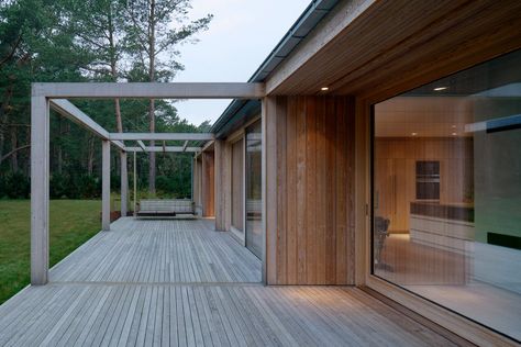 Johan Sundberg transforms Swedish summer house with larch wood Johan Sundberg, House With A Garden, Swedish Summer House, Modern Contemporary House, Wraparound Deck, Green Village, Larch Wood, Rural House, Porch Flooring