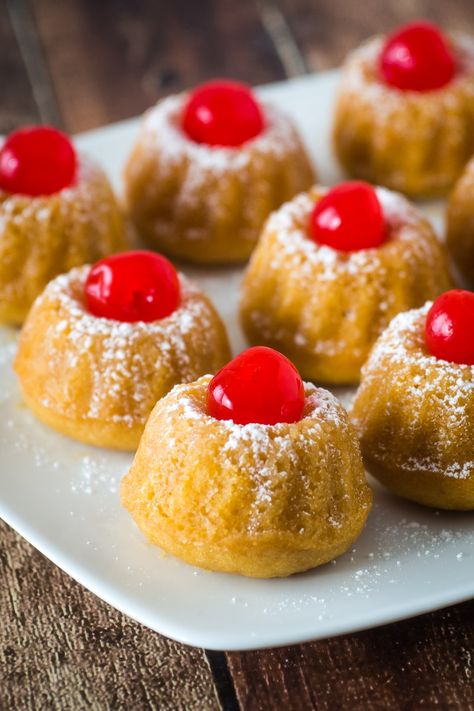 Mini rum cake is a delicious dessert for a special occasion. Made from a cake mix base the cakes are soaked in rum and topped with powdered sugar and cherries. With rum in the cake batter and a tasty rum sauce topping these mini cakes are rich and delicious. #rumcake #cake #christmas #minidessert Mini Rum Cakes, Pecan Pie Mini Muffins, Irish Dessert Recipes, Upstate Ramblings, Candy Cane Dessert, Rum Cakes, Mini Bundt Cakes Recipes, Irish Desserts, Mini Pecan Pies