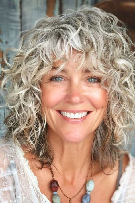 Curly Gray Hair With Bangs, Curly Medium Length Hair With Bangs, Curly Gray Hair Over 50 Curls With Bangs, Fine Curly Hair Cuts Shoulder Length, Curly Cuts With Bangs, Shaggy Haircuts For Curly Hair, Curly Hair With Bangs And Layers, Curly Shag Haircut Medium, Shoulder Length Curly Hair With Layers