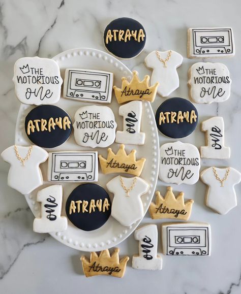 The Notorious One 👑📼 • #cookie #cookies #decoratedcookies #cookiesofinstagram #cookiehack #cookietip #cookiedecorating #satisfying #satisfyingreel #cookier #newcolors #thisweekscolors #jdsugarcookies #sugarcookies #royalicing #thenotoriousone #thenotorious #birthdaysugarcookies #firstbirthdaycookies #one #crowncookies #cassette #cassettecookies #necklacecookies #onesiecookies Notorious One, Crown Cookies, Onesie Cookies, First Birthday Cookies, Cookie Hacks, Birthday Cookies, Sons Birthday, Royal Icing, Cookie Decorating