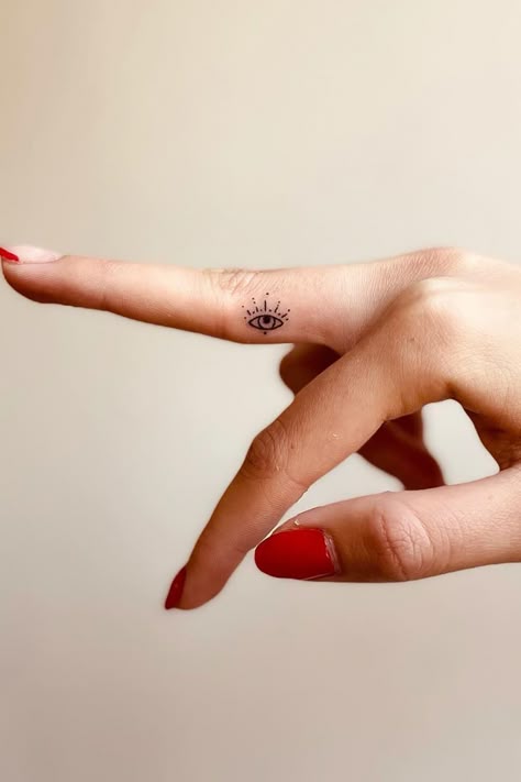 Evil Eye Finger Tattoo Simple, Mini Tattoos Evil Eye, All Knowing Eye Tattoo, Instagram Bio Ideas Evil Eye, Cool Eye Tattoo Ideas, Evil Eye Micro Tattoo, Tiny Evil Eye Tattoo Finger, Nazar Tattoo Design, Delicate Evil Eye Tattoo