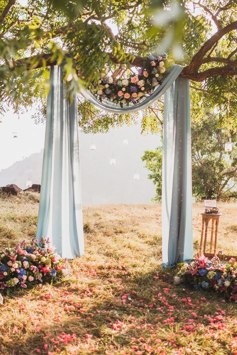 Wedding Fabric Draping Tree, Wedding Tree Drapes, Fabric Tree Wedding Arch, Tree Drape For Wedding, Outdoor Boho Ceremony, Tree Ceremony Backdrop, Fabric Ceremony Backdrop, Simple Wedding Arch Outdoors, Tree Arch Wedding