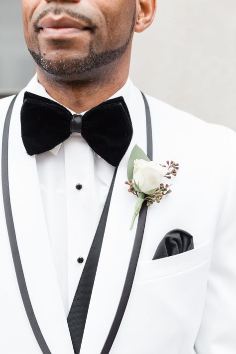 A Glam Blush and Gold Wedding Overflowing with Style - Groom in White Tuxedo with Black Vest, Bow Tie, and Pocket Square White Wedding Tuxedo, 50s Chic, Groom In White, White Tuxedo Wedding, White Tuxedo Jacket, Tuxedo Styles, Infinity Roses, Blush And Gold Wedding, Black And White Wedding Theme