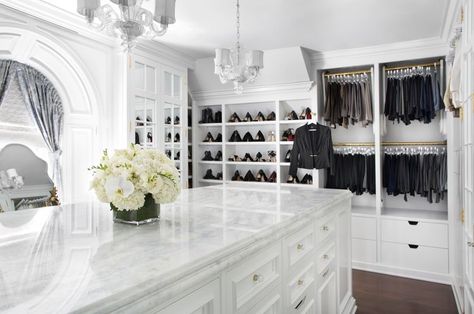 Gorgeous closet features two chandeliers illuminating a long closet island fitted with drawers for accessories topped with marble countertop. Island In Closet, Nj House, A Walk In Closet, Closet Island, Closet Planning, White Closet, Walk In Closet Design, Beautiful Closets, Luxury Closets Design