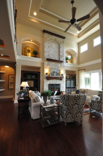 Grand 2-Story Great Room ceilings in our Sequoia Model #TimOBrienHomes Small Living Room With High Ceilings, Bookcases Fireplace, Couch Layout, High Ceiling Living Room, Free House Plans, Tall Windows, Country Craftsman, Home Fireplace, Beautiful Interior Design