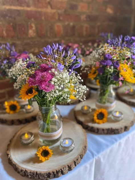 Flower Theme Table Decor, Wildflower Centerpieces With Candles, Wedding Spring Table Decor, Wild Flower Centre Piece Wedding, Summer Flower Centerpieces Wedding, Simple Fall Wedding Centerpieces Cheap, Jam Jar Wedding Decorations, Farm Table Wedding Flowers, Wild Flower Wedding Table Arrangements