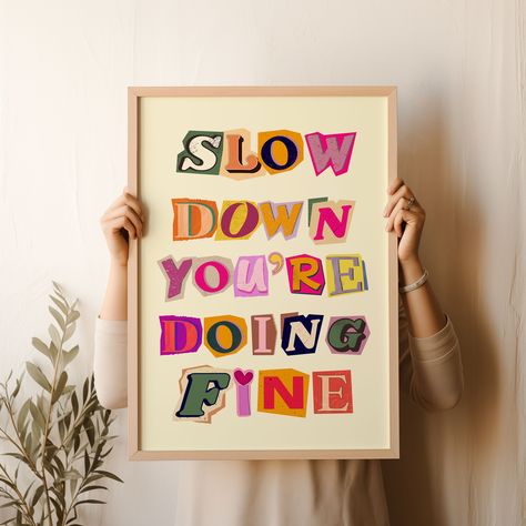 Brighten up your space with the "Slow Down You're Doing Fine" wall art featuring vibrant symbols made with recycled magazines. This trendy and aesthetic poster serves as a daily reminder with uplifting Billy Joel lyrics, making it the perfect affirmation wall art for any room. Let Billy Joel's quote inspire good vibes and bring a touch of positivity to your dorm or home. Add a splash of color and motivation to your walls with this unique art print that is sure to uplift your spirits every day. Y Billy Joel Poster, Billy Joel Lyrics, Colorful Magazine, Art Symbols, Recycled Magazines, Billy Joel, Fine Print, Trendy Wall Art, Wall Deco