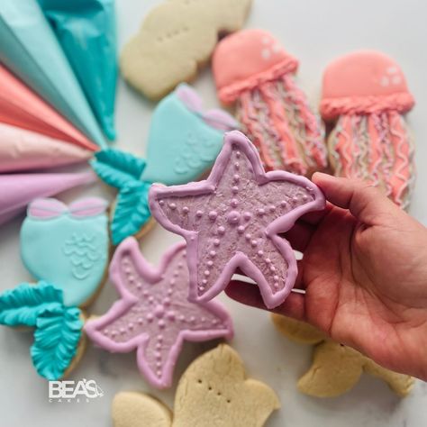 Join us at Wandering Roots on Saturday, June 8th 2:30-4pm for our second joint decorated cookie workshop. This time, we will decorated Beach theme vanilla sugar cookies: jellyfish, mermaid tail and sea star 🌟 Each ticket includes: - 3 fresh baked cookies to decorate in a summery beach theme - Royal icing in various colors - instruction on working with Royal icing and decorating techniques. - one medium sized air plant of your choice from selection - dome shaped shell - instructions... Cookie Workshop, Royal Icing Consistency, Icing Consistency, Jellyfish Mermaid, Cookies To Decorate, Vanilla Sugar Cookies, Theme Cookies, Vanilla Sugar Cookie, Fresh Baked Cookies