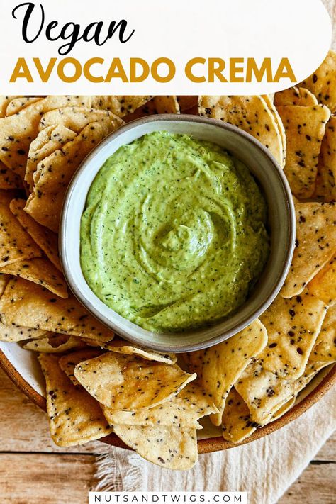 top view of a bowl of vegan avocado crema surrounded by chips. The picture is labeled with the words 'vegan avocado crema, nutsandtwigs.com'. Avocado Crema Vegan, Avocado Crema Recipe, Crema Recipe, Vegan Sauce, Avocado Crema, Hearty Chili, Creamy Dip, Vegan Yogurt, Vegan Sauces