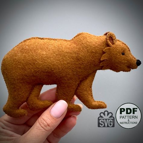 PDF pattern for Felt Grizzly Bear. This PDF hand sewing pattern will give you a pattern and step by step instruction to make a Felt Grizzly Bear. All instructions are written in English. Also, in the PDF file you will find links to videos (YouTube), in which all the stitches we use are filmed in detail. - This listing is for an instant-download (PDF PATTERN) - This is not a finished toy. Our store sells exclusively patterns and instructions for hand-sewing toys. Any materials and tools are also Sewing Patterns Animals, Diy Felt Animals Patterns Free, Felt Bear Pattern, Pattern Felt Animals, Felt Moose, Felt Christmas Ornament Patterns, Felt Animal Ornaments, Felt Wolf, Felt Patterns Free