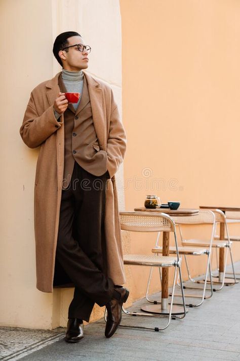 Young man wearing glasses drinking coffee while standing on city stock photos Fringe Photoshoot, Drinking Pose Reference, Drinking Coffee Pose, People Sitting At Table, Man Wearing Glasses, Photoshoot Male, Face Challenge, Drawing Refrences, Ancient Indian Art