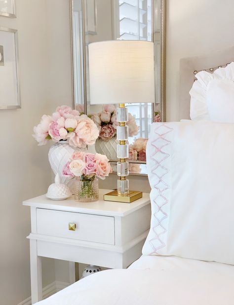 Flower Home by Drew Barrymore – The Decor Diet  White ginger jar, faux pink peonies nightstand glam bedroom Peony Room Decor, Flowers In The Bedroom, White Night Stand Decor, Flowers On Nightstand Aesthetic, Townhouse Home Decor, Bedroom Nightstands Ideas, Flower In Bedroom, White Nightstand Bedroom Ideas, One Night Stand Bedroom Ideas