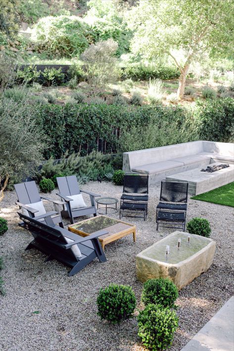 Outdoor Seating Area With Rocks, Fire Pit With Built In Bench, Gravel Seating Area, Mediterranean Yard, Built In Fire Pit, Backyard Bars, Outdoor Garden Bed, Backyard Sitting Areas, Fire Pit Bench