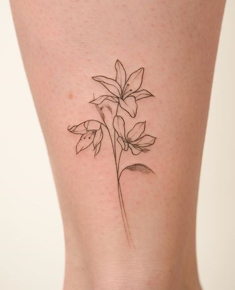 Minimal Lily Flower Tattoo, Amaryllis Tattoo Design, Small Lilly Flower Tattoo, Minimalist Lily Tattoo, Triplet Tattoos, Easter Lily Tattoo, Amaryllis Tattoo, Lilly Flower Tattoo, Blue Flower Tattoos