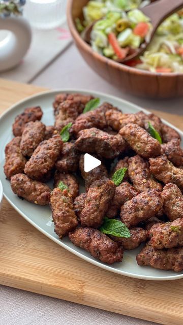 Marium Rizwan on Instagram: "Irresistible mouth watering bite size yogurt kebabs  Perfect for Bakra Eid special   ✨Ingredients   •850 g mutton /beef /chicken mince  I used mutton mince with 20% fat  •250g Greek yogurt  •1 Medium size onion (fine chopped & squeeze) •2tbsp Ginger & Garlic paste  •4-5 green chilies (fine chopped) •Handful Fresh coriander leaves ( chopped) •1tsp ground cumin  •1tbsp ground coriander  •1tsp chili flakes  •Salt to taste •1tsp red chilli powder  •1/2 tsp turmeric  •1tsp kachri powder  •1tsp garm masala  •1/2 tsp baking soda •2 tbsp Seekh kabab masala  •3 tbsp plain flour  •Oil for frying   ✨Instructions In a large mixing bowl, combine the all ingredients except plain flour  Cover the bowl and refrigerate for at least 1 hour, preferably overnight, to allow the fla Mutton Seekh Kabab, Paratha Roll, Seekh Kebabs, Seekh Kabab, Chicken Mince, Bakra Eid, Kebab Skewers, Kebabs On The Grill, Ginger Garlic Paste