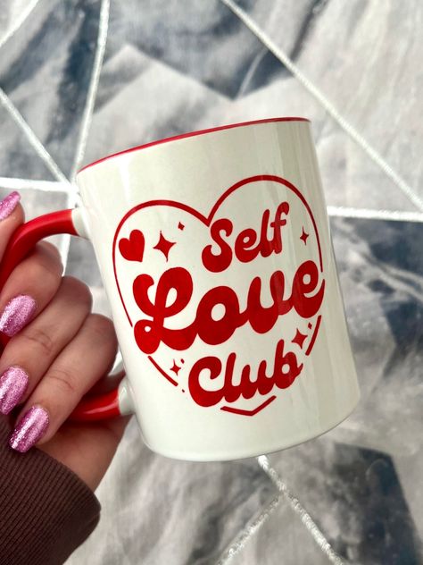 Ceramic mug with ‘Self Love Club’ quote. Made using a high quality mug with sublimation so you don’t have to worry about the quote peeling off or fading. Inside the mug is red as well as the handle. 11oz Dishwasher and microwave safe. Valentines Day Mug Gift Ideas, Mug Inspo Design, Mugs Designs Ideas, Mug Sublimation Ideas, Valentines Mugs Ideas, Valentines Day Ceramics, Cute Coffee Mugs Designs, Tazas San Valentin Ideas, Mug Design Ideas Creative