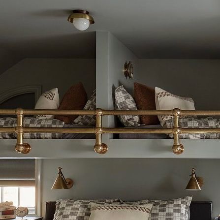 Becca Interiors on Instagram: "“Our thinking didn’t stray far from the young family’s needs, and after a custom bunk bed was requested, the fun really had begun. Brass posts were custom created to outfit a bunk bed system, laying grounds for many exciting sleepovers to be had.” Swipe to see the beginnings of this boys’ room, and visit the link in our profile to see more from our #WeeBurnReno project! #BeccaInteriors #AyrBarns 📷 @rikkisnyder" Bunk Beds Sloped Ceiling, Bunk Bed Railing, Custom Bunk Bed, Becca Interiors, Custom Bunk Beds, Future Boy, Brass Pipe, Surf House, Garage Makeover