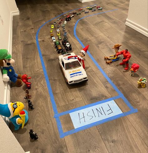 Elf On The Shelf Ideas With Toy Cars, Elf On The Shelf Ideas With Hotwheels, Elf On The Shelf Racing, Elf On The Shelf Race Track, Elf On The Shelf Excavator, Car Elf On The Shelf Ideas, Hot Wheels Elf On The Shelf, Elf On The Shelf Ideas With Cars, Elf On The Shelf Cars