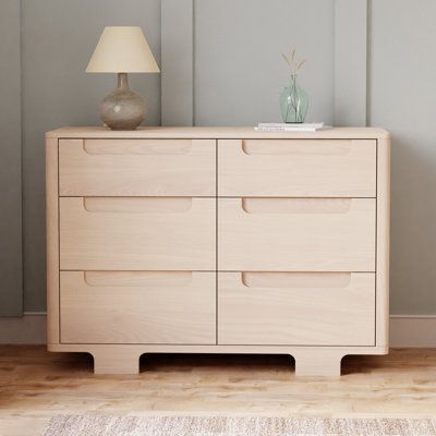 Designed to complement the Yuzu 8-in-1 All-Stages , the Yuzu 6-Drawer Dresser marries form and function with playful arched feet, gently curved corners and plenty of storage with 6 spacious drawers. Whether you're going for a classic, modern, or eclectic look, this versatile dresser is a perfect statement piece in the nursery. Color: Washed Natural babyletto Yuzu 6-Drawer Dresser in Washed Natural | Size 40" H X 19" W X 48" D | AllModern