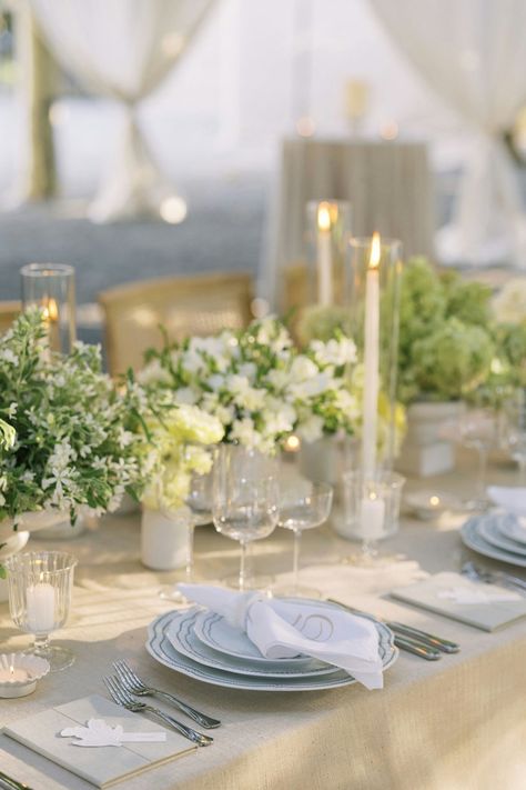 Creamy white florals and soft candlelight create a romantic tablescape for any outdoor celebration. Romantic Tablescape, Outdoor Celebration, Best Destination Wedding, Wedding Planning Services, White Florals, Outdoor Reception, Best Wedding Planner, Destination Wedding Planner, Wedding Planners