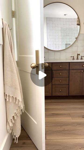 KNOXVILLE HOME BUILDER | Derek & Marina Wiersma on Instagram: "Save this post if you’re looking to add warmth and character to your bathroom ✨  We wanted this small bathroom to feel like a comfortable place where we could have a relaxing end to our day. The wood and brass tones add warmth while the tile and linen add texture. Details listed below 🤍  Floors: @coretecfloors Wiltshire Oak Tile: MLW Piazza Tile - White  Faucets: @deltafaucet  Lights: @crateandbarrel  Door hardware: @emtek_products   #bathroomdesign #bathroominspiration #bathroomdetails #tile #bathroomtile #housedesign #housetohome #houseinspo" Oak Bathroom Floor, Bathroom Wood Floor, Bathroom Selections, Wood Floor Bathroom, Coast House, White Faucet, Oak Bathroom, Comfortable Place, Wood Bathroom