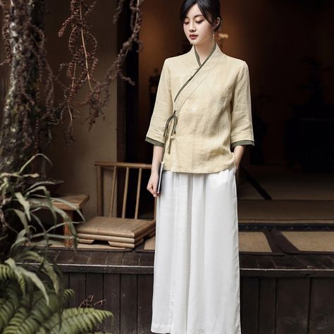 Embrace traditional elegance with our Beige Chinese style Women's Top and Pants Two Piece Set.This is the style of Chinese Taoism, which is the integration of people and nature, and this dress has stripped away the complicated lines and integrated people into nature. This set is perfect for cultural events, casual outings, and creating a sophisticated, timeless look. Features High-Quality Material: Made from breathable and comfortable fabric, perfect for all-day wear. Elegant Details: Includes i Chinese Style Shirt, Zen Tea, Tang Suit, Chinese Hanfu, New Chinese Style, New Chinese, Style Shirt, Cheongsam, Two Piece Set