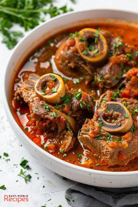 Ossobuco, also known as Osso Buco is a traditional Italian dish, with braised veal shanks cooked with vegetables, white wine, and broth until tender. Venison Osso Bucco Recipe, Pork Osso Bucco Recipe, Italian Meat Dishes, Osso Bucco Recipe, Beef Shank Recipe, Homemade Beef Stew Recipes, Osso Buco Recipe, Veal Shank, Italian Main Dishes