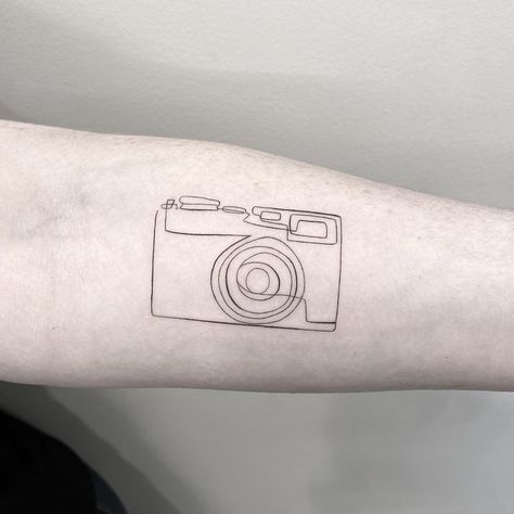 Camera Line Tattoo, Small Camera Tattoo, Photographer Tattoo Ideas, Polaroid Tattoo, Rib Tattoos Words, Arm Quote Tattoos, Camera Tattoo Design, Photographer Tattoo, Toronto Tattoo