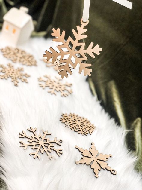 "10 Festive Wooden Snowflakes. Can be done in silver glitter or in a finished birch!  They are done in a mixed Design or can also be done in one design ( please contact us for this) Laser cut for crisp and clear lines.  Each snowflake varies in size- approximately 3 by 2\" Does not come with string to hang snowflakes." Wooden Snowflake Ornaments, Wilderness Decor, Laser Cut Snowflake, Wooden Snowflakes, Christmas Tree Toy, Decor Bundle, Snowflake Ornaments, Vintage Christmas Ornaments, Christmas Signs