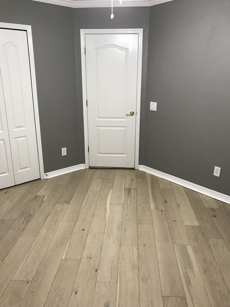 Loving these diagonal engineered hardwood wide plank hand scraped light grey oak floors with behr casual grey walls. Wood Floors Grey Walls, Reclaimed Wood Furniture Diy, Light Grey Oak Flooring, Cheap Wood Flooring, House Trends, Grey Wood Tile, Wood Floor Stain Colors, Grey Hardwood Floors, Types Of Wood Flooring