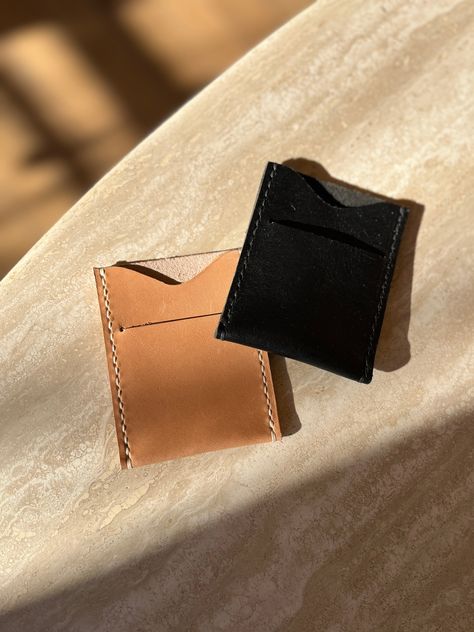 This slim pocket wallet is the perfect minimal holder for your credit cards or business cards. The single pocket with a card slit allows for easy organization and storage, without adding bulk. Perfect for those who like to keep things simple and sleek. Dimensions: 2.75" x 3.5" Hand-stitched with waxed thread This item is made to order - please allow 1-2 weeks before shipping Since leather is a natural material, each piece may vary ever so slightly in color and texture. Organization And Storage, Pocket Wallet, Easy Organization, Natural Material, Hand Stitched, Credit Cards, Hand Stitching, Business Cards, Credit Card