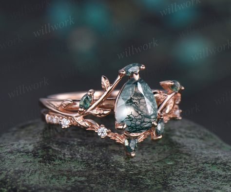 - Metal: Solid gold(10K/14K/18K white/yellow/rose gold),925 sterling silver,platinum available- Main Stone: 6x8mm pear cut natural moss agate- Accent Stone: moss agates- Wedding Band Stone: moss agate and moissanites- Band Width: 1.4mm- Can be personalized: Yes Moss Agate And Sapphire Engagement Ring, Mossy Agate Wedding Ring, Rose Gold Moss Agate Engagement Ring, Rose Gold Moss Agate Ring, Moss Agate Ring Gold, Natural Engagement Ring, Chocolate Engagement Rings, Green Moss Agate Engagement Ring, Non Traditional Wedding Rings Sets