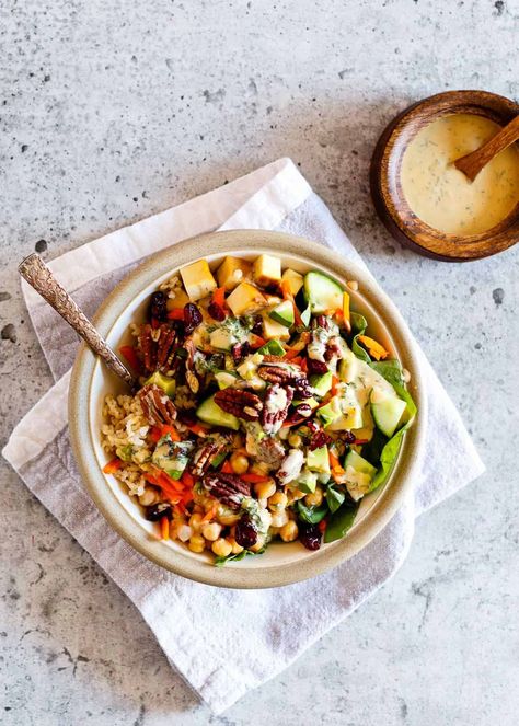 The Vegan Goddes Bowl contains rice, spinach, chickpeas, tofu, avocado, pecans, cranberries and Tahini Goddess Dressing. Nutritious and ready in 20 minutes. Goddess Bowl, Buddha Bowl Sauce, Vegan Bowl Recipes, Vegan Board, Garlic Roasted Broccoli, Lunch Bowl, Dairy Queen, Vegan Bowls, Tahini Dressing