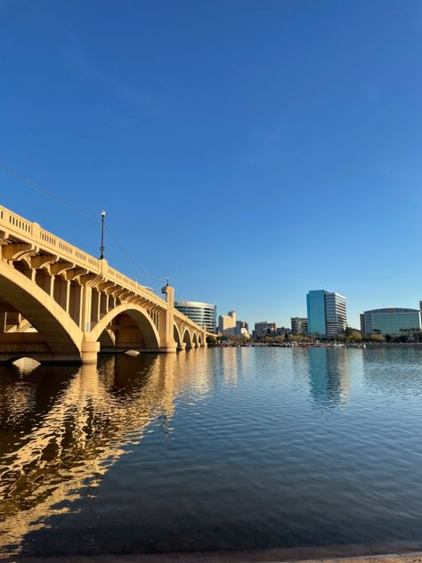 View from Tempe town lake shore, bridge and buildings reflecting on the water Tempe Arizona Aesthetic, Tempe Arizona Things To Do In, Phoenix Temple, Phoenix Downtown, Tempe Town Lake, Tempe Arizona, Phoenix Arizona Downtown, Arizona Adventure, Living In Arizona