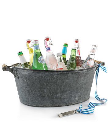 Multiple beverage stations help ensure that guests can get a refill without waiting. Galvanized tubs, colorful enamel buckets, and planters work perfectly. Place an assortment of drinks in each bin if they're destined for different locations throughout the yard. Or fill each container with a single type, such as imported beer, white wine, or bottled water. With ribbon, tether an opener to a handle of each bin; drape a dish towel nearby to take care of condensation. Summer Party Hacks, Vintage Soda Bottles, Drink Bucket, Bobbing For Apples, Galvanized Tub, Outdoor Dinner Parties, Beverage Tub, Wine Bucket, Outdoor Dinner