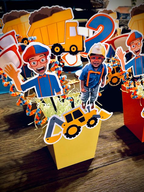 DIY Blippi party decorations Blippi Birthday Party At The Park, Blippi Birthday Centerpiece, Blippi Table Decorations, Blippi Party Centerpieces, Blippi Party Decorations, Meeka Birthday Party, Diy Blippi Party Decorations, Blippi Centerpiece Ideas, Blippi Party Favors