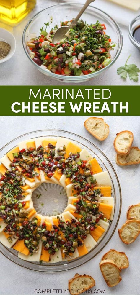 This marinated cheese wreath of your favorite cheeses topped with a mixture of olives, roasted red peppers, onions, herbs, and balsamic vinegar is the easiest and most festive holiday appetizer! | best holiday appetizers | cheese wreath platter | cheese wreath appetizer | cheese party trays | cheese party snacks | marinated cheese appetizer | marinated cheese peppers and olives | marinated cheese recipe | marinated cheese balsamic | holiday marinated cheese | holiday party food Cheese And Olive Tray Ideas, Marinated Cheese Plate, Cheese Party Trays, Party Food Dishes, Best Holiday Appetizers, Marinated Cheese, Appetizers Table, Cheese Party, Meat Appetizers