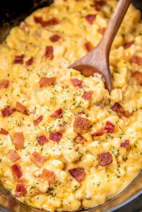 Slow Cooker Cheesy Bacon Potatoes - our go-to potato casserole! Super simple to make and tastes amazing. Simply mix together frozen diced potatoes, cream of potato soup, cream of chicken soup, sour cream, cheddar cheese, and cooked bacon in the crockpot and cook. The potatoes are super creamy and delicious. This is a great recipe for potlucks, cookouts, dinner parties, and the holidays! Give this a try the next time you need an effortless side dish. Potato Recipes Crockpot, Plain Chicken Recipe, Cheesy Bacon Potatoes, Bacon Potatoes, Slow Cooker Bacon, Slow Cooker Potatoes, Cream Of Potato Soup, Quick Side Dishes, Bacon Potato