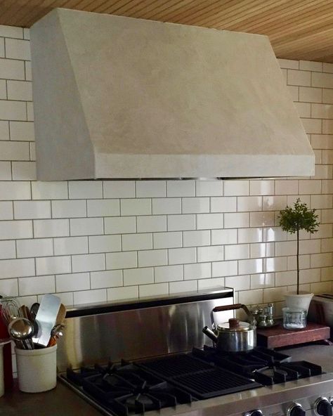 ion was to paint this stove hood. But lime plaster seemed more substantive, hard-wearing, and appropriate for an element in the kitchen subjected to heat and moisture. The plywood outer shell of the hood was primed, plastered, and then, to lighten the color somewhat from the natural gray plaster, limewashed in two light coats.” Stove Hood, Lime Plaster, Oven Hood, Hood Ideas, Antique Brick, Brick Fireplace Makeover, Diy Plaster, Lime Paint, Kitchen Range Hood