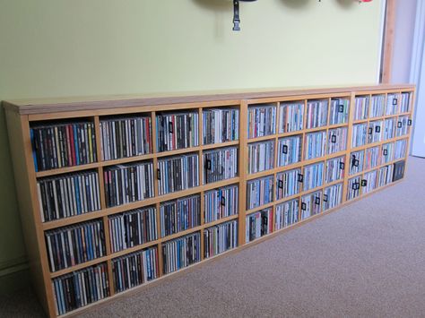 Materials: Billy Bookcase (80x202cm), 6 x Billy CD inserts, 24mm birch faced ply I kept my CD collection in a Billy bookcase for which I’d purchased the CD inserts (I think these are now discontinued). I’ve redecorated my home office and didn’t want the tall bookcase; I wanted to hang guitars on the wall, and this [&hellip Ikea Cd Storage, Painting Particle Board Furniture, Billy Regal Hack, Ikea Dvd Storage, Vhs Storage, Lp Regal, Cd Shelves, Billy Ikea, Billy Bookcases