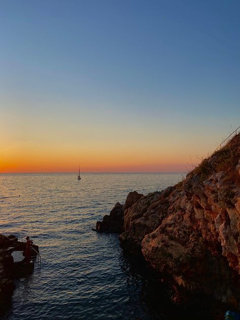 Pretty orange red sunset at a rocky beach cliff in croatia Rocky Beach Sunset, Beach Sunset Aesthetic, Rocky Beach, Pretty Sunset, Sunset Aesthetic, Beach Sunset, Croatia, Rocky